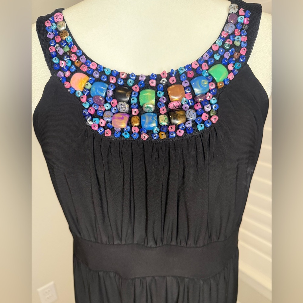 Cato Black dress with colorful stones at the neckline. 5%spandex Size M